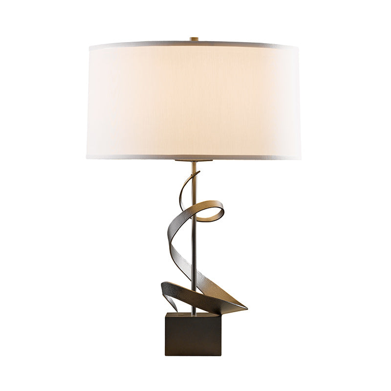Gallery Spiral Table Lamp with twisted bronze base and white drum shade by Hubbardton Forge, American made artisan lighting.