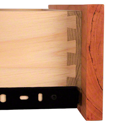 A small piece of wood with a hole in it.