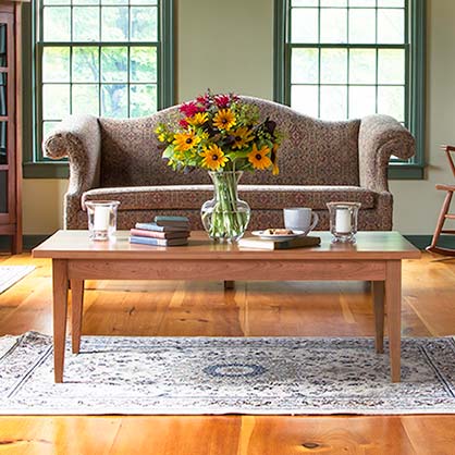 A living room with a couch and a coffee table.