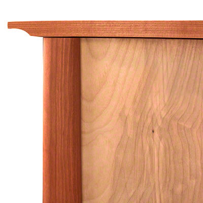 A close up of a wooden cabinet door.