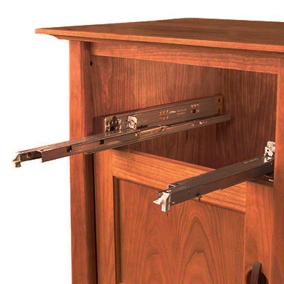 A wooden tv cabinet with a sliding door.