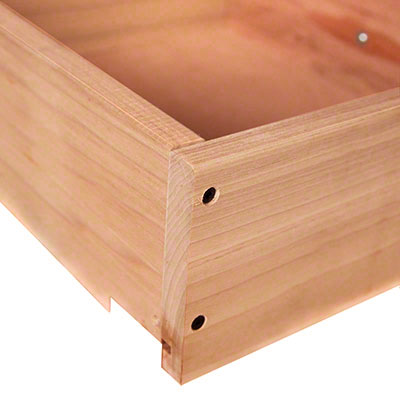 A close up of a wooden box on a white background.