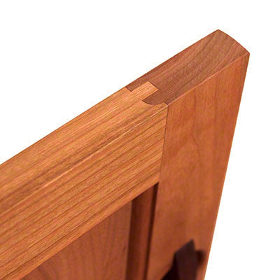 A close up of a wooden door handle.