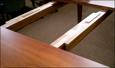A wooden table with a wooden top.