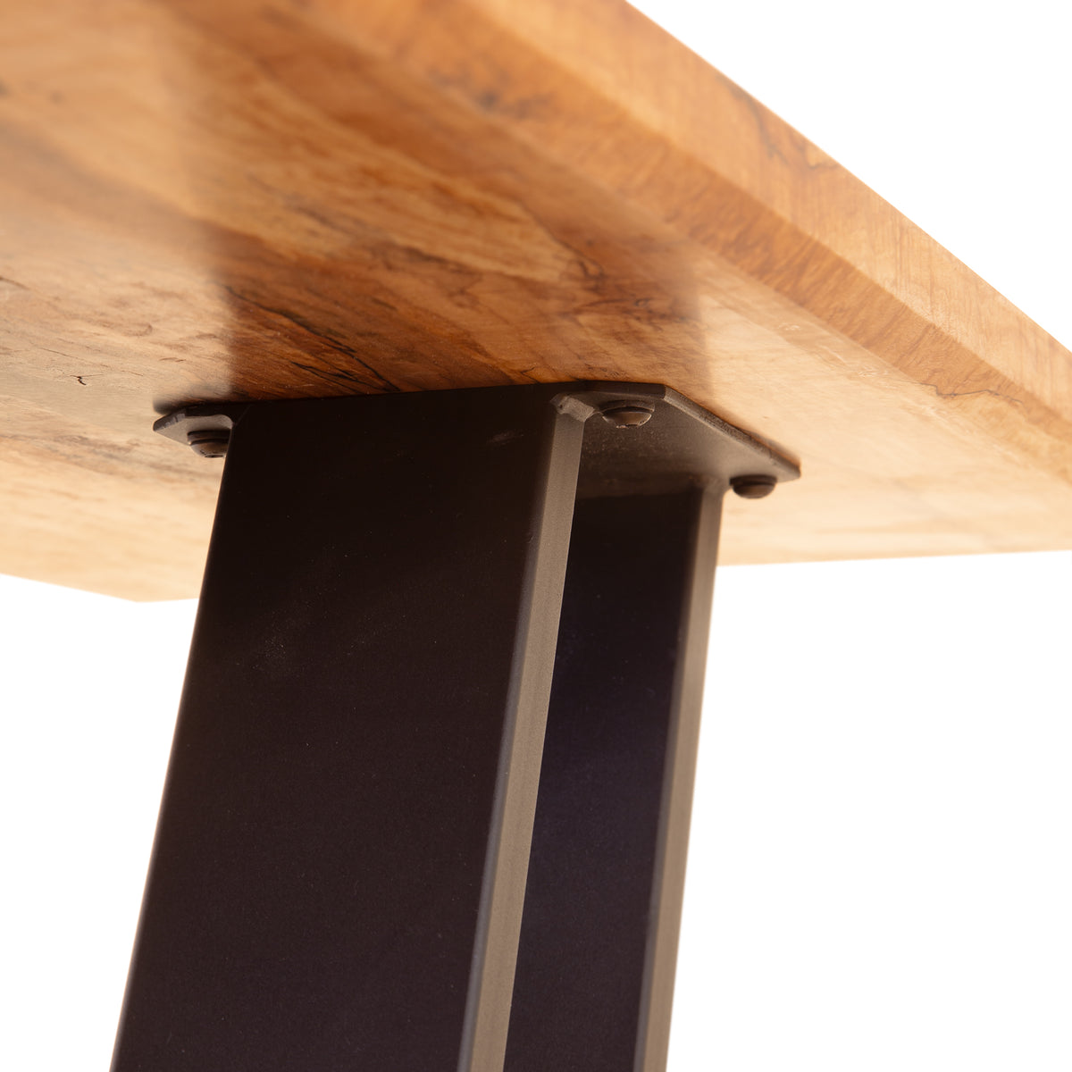 Close-up of the Mike Messer Spalted Maple Artisan Console Table, featuring a black metal bolt base and modern industrial design.