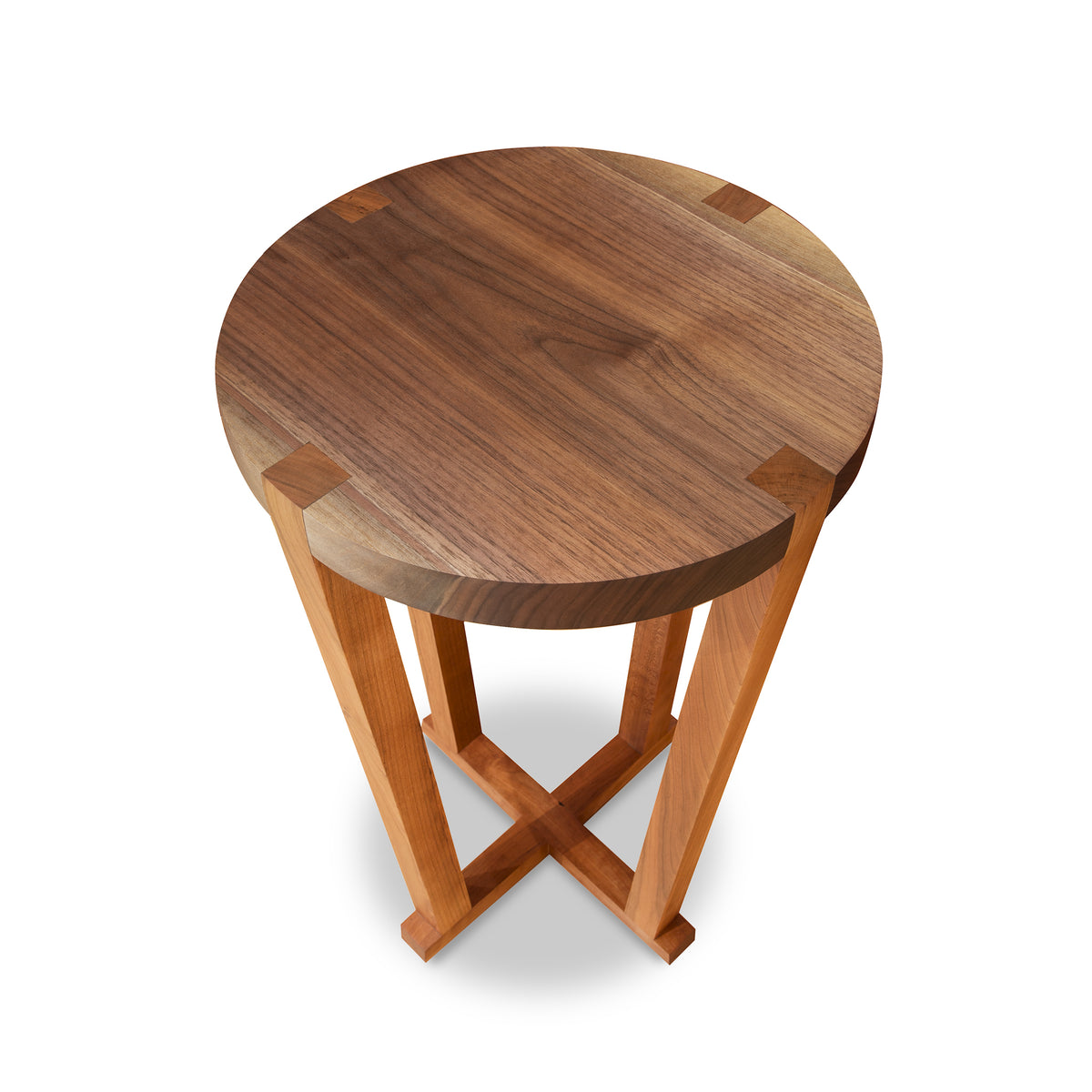 Round solid cherry and walnut end table by Mike Messer with cross-braced support, artisan crafted, top view.