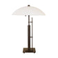 Metra Double Table Lamp by Hubbardton Forge with geometric modern black metal base in natural iron finish, showcasing American craftsmanship.