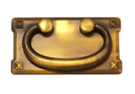 A brass plate with a smiley face on it.
