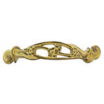 An ornate brass pull with an ornate design.