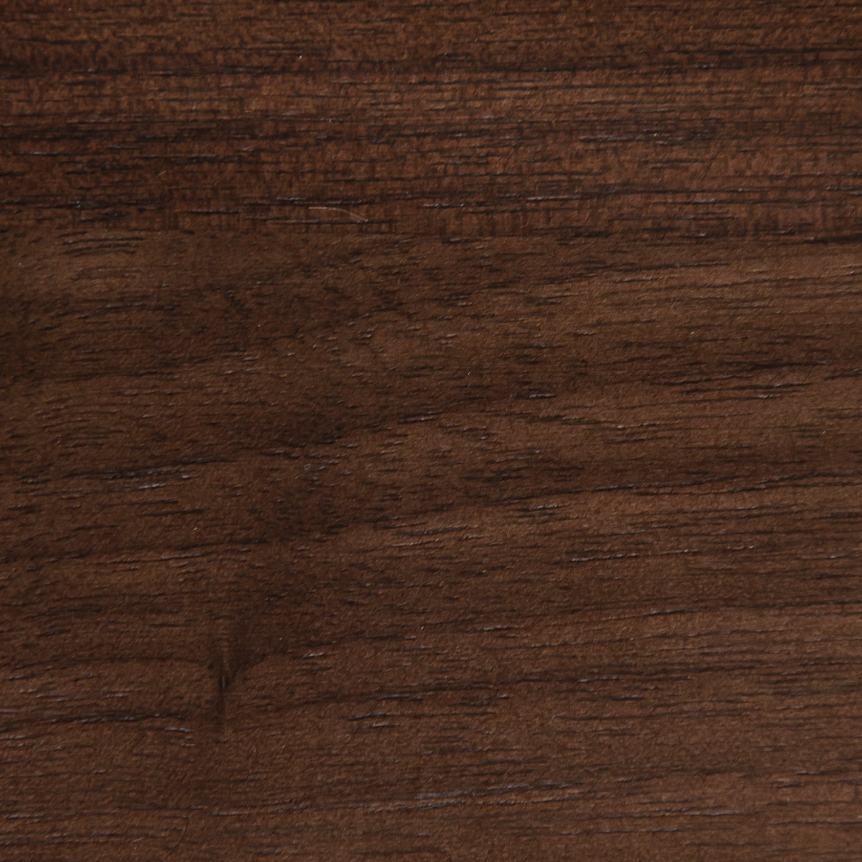 A close up view of a dark brown wood surface.
