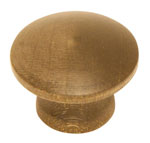 A round brass knob on a white background.