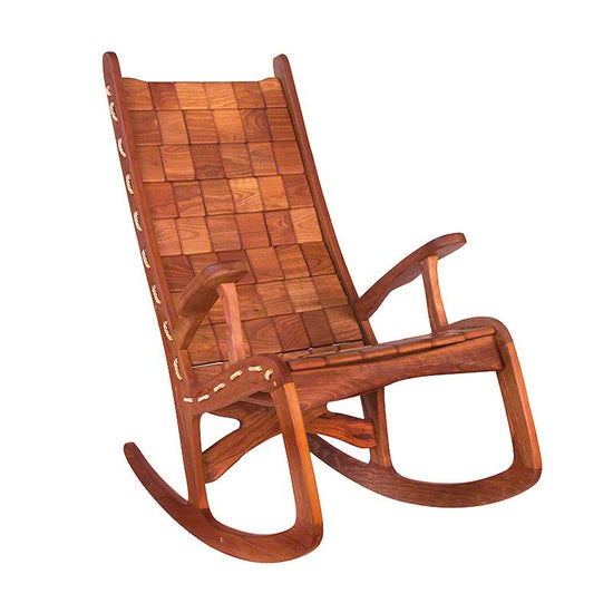 A wooden rocking chair with a woven seat.