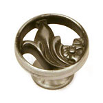 A silver cabinet knob with a floral design.