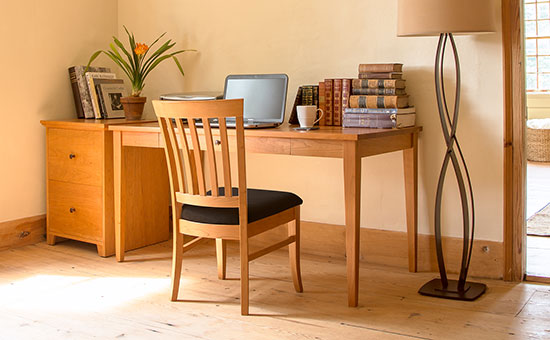 High-quality American-made wooden desk with matching chair, showcasing craftsmanship and design.