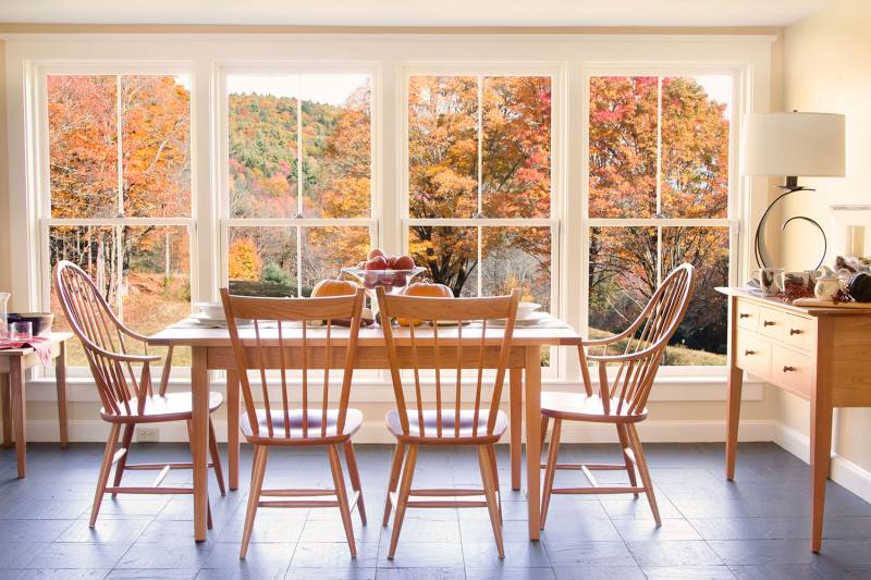 A dining room with a view of the mountains.