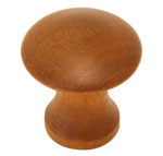 A wooden knob on a white background.
