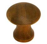 A wooden knob on a white background.