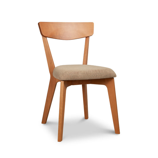 A Lyndon Furniture Sheldon Chair with Barley Upholstered Seat featuring natural wood construction, a smooth, curved backrest, and a padded seat covered in beige fabric, isolated on a white background.