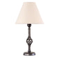 Hubbardton Forge Small Twist Basket Table Lamp with a twisted dark metal base and beige shade, showcasing elegant handcrafted American design.