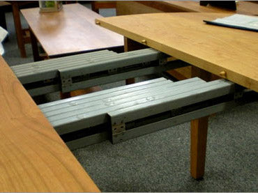 A desk with a table underneath it.