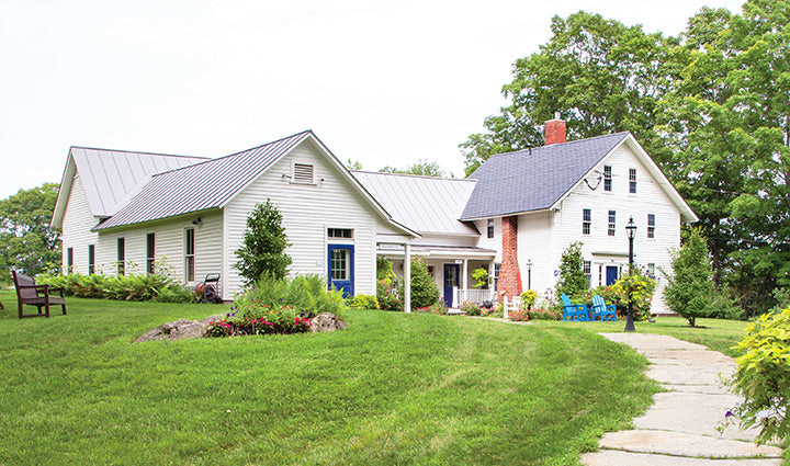 White wooden farmhouse-style outdoor seating with blue accents.
