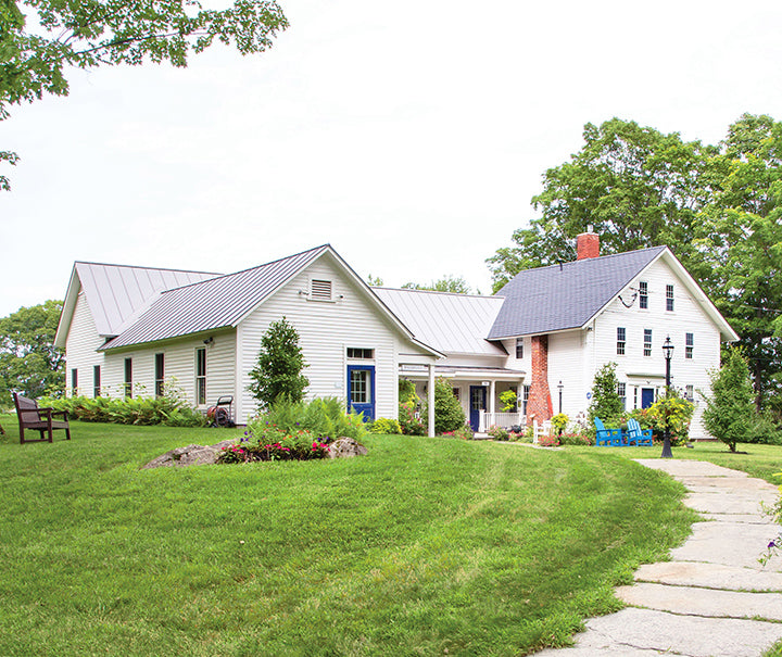 White farmhouse-style furniture with a sleek gray metal finish, ideal for creating a cozy and inviting atmosphere.