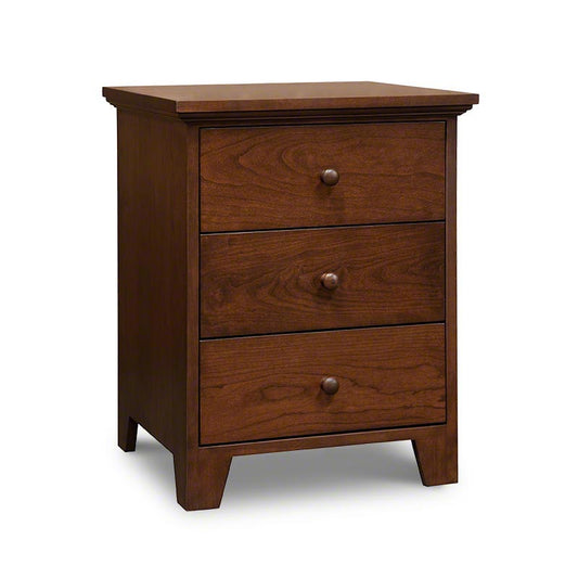 A nightstand with three drawers on a white background.