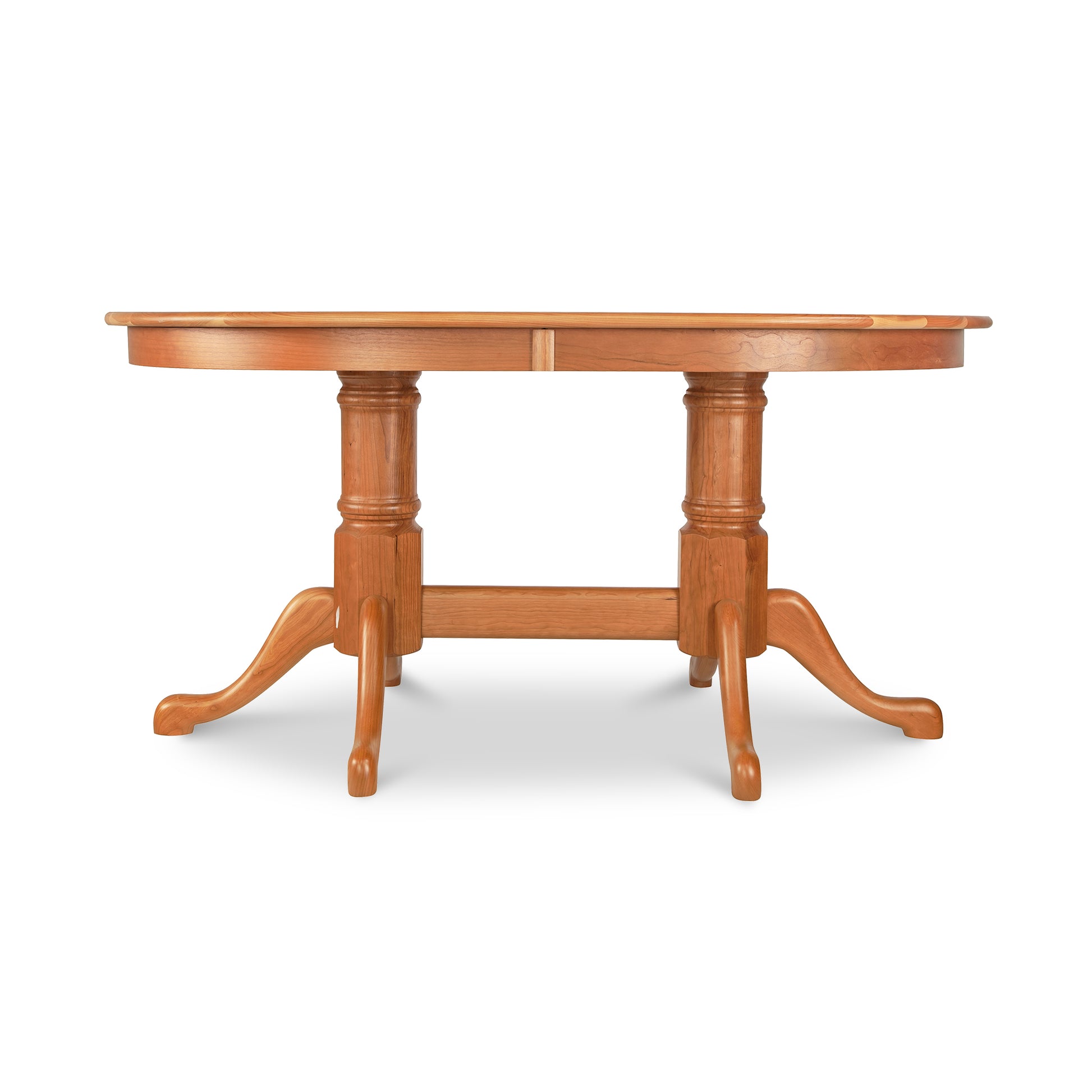A wooden dining table with three legs.