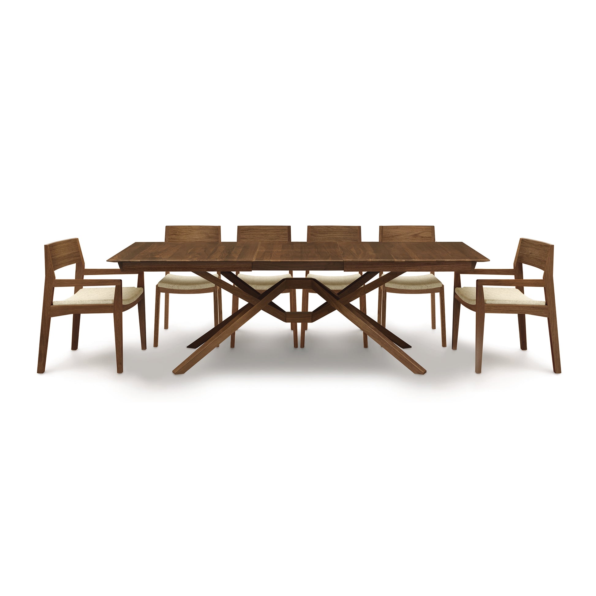 A wooden dining table with six chairs.