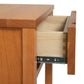 A wooden nightstand with a drawer.