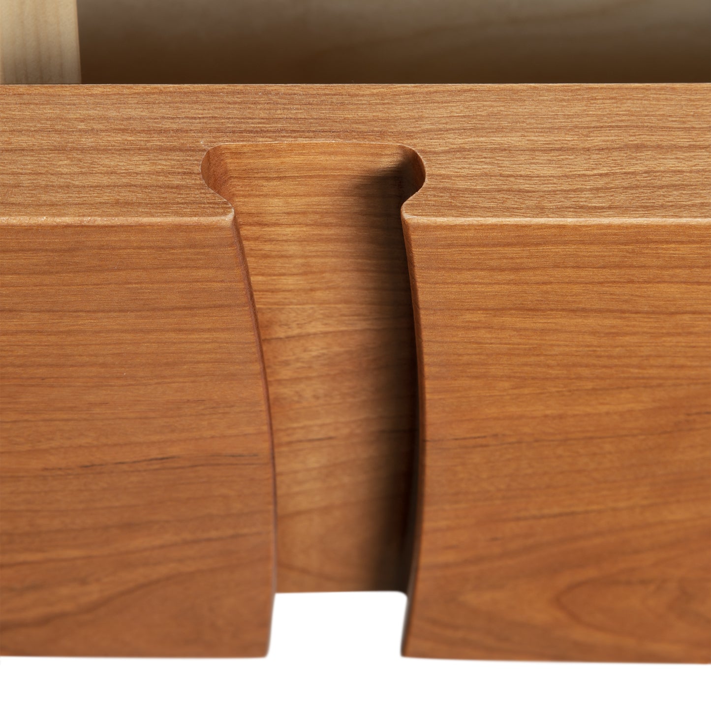 A close up view of a wooden drawer.