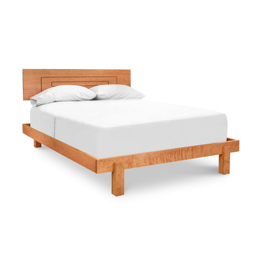 A bed with a wooden frame and white sheets.