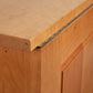 A close up view of a wooden cabinet.