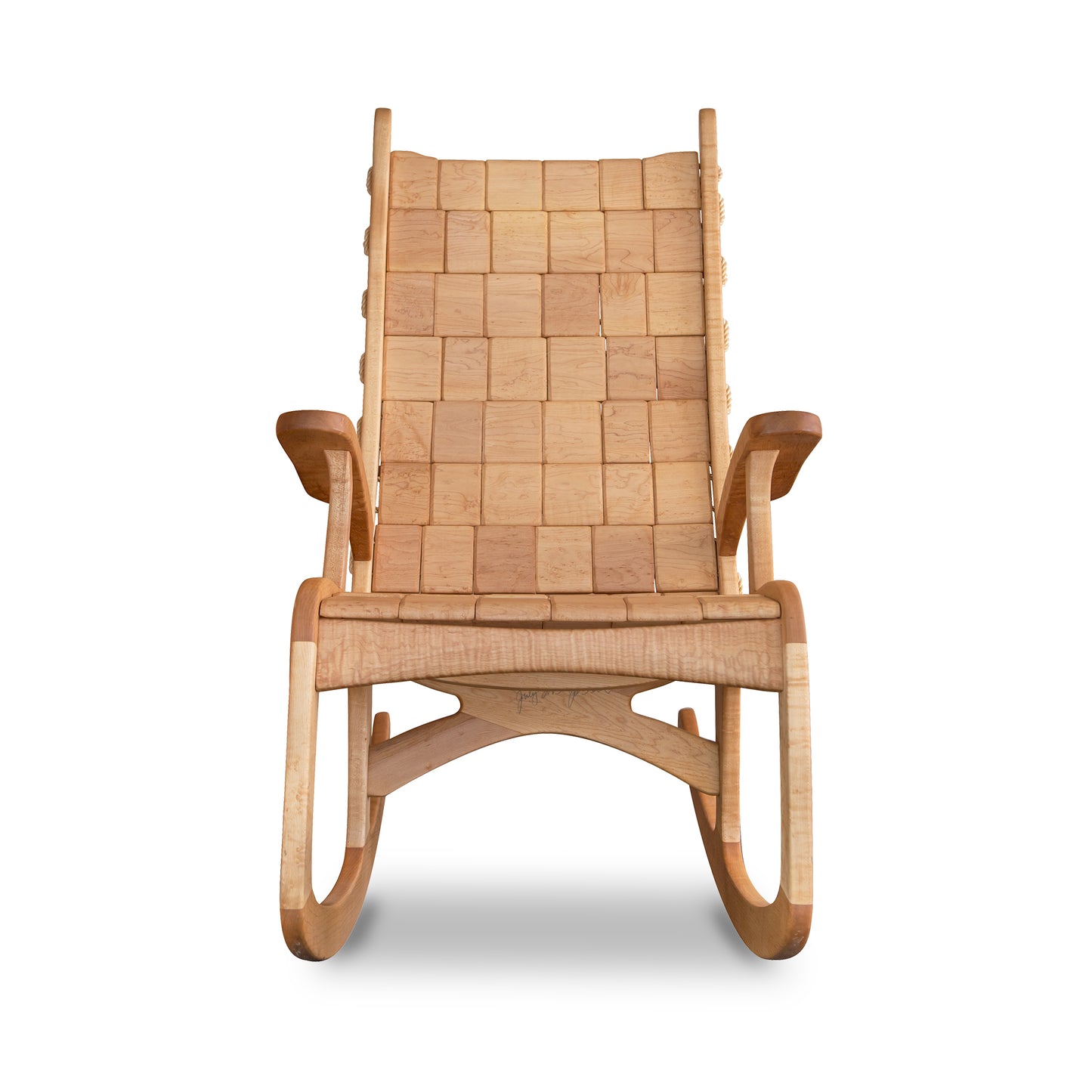 A wooden rocking chair with a woven seat.