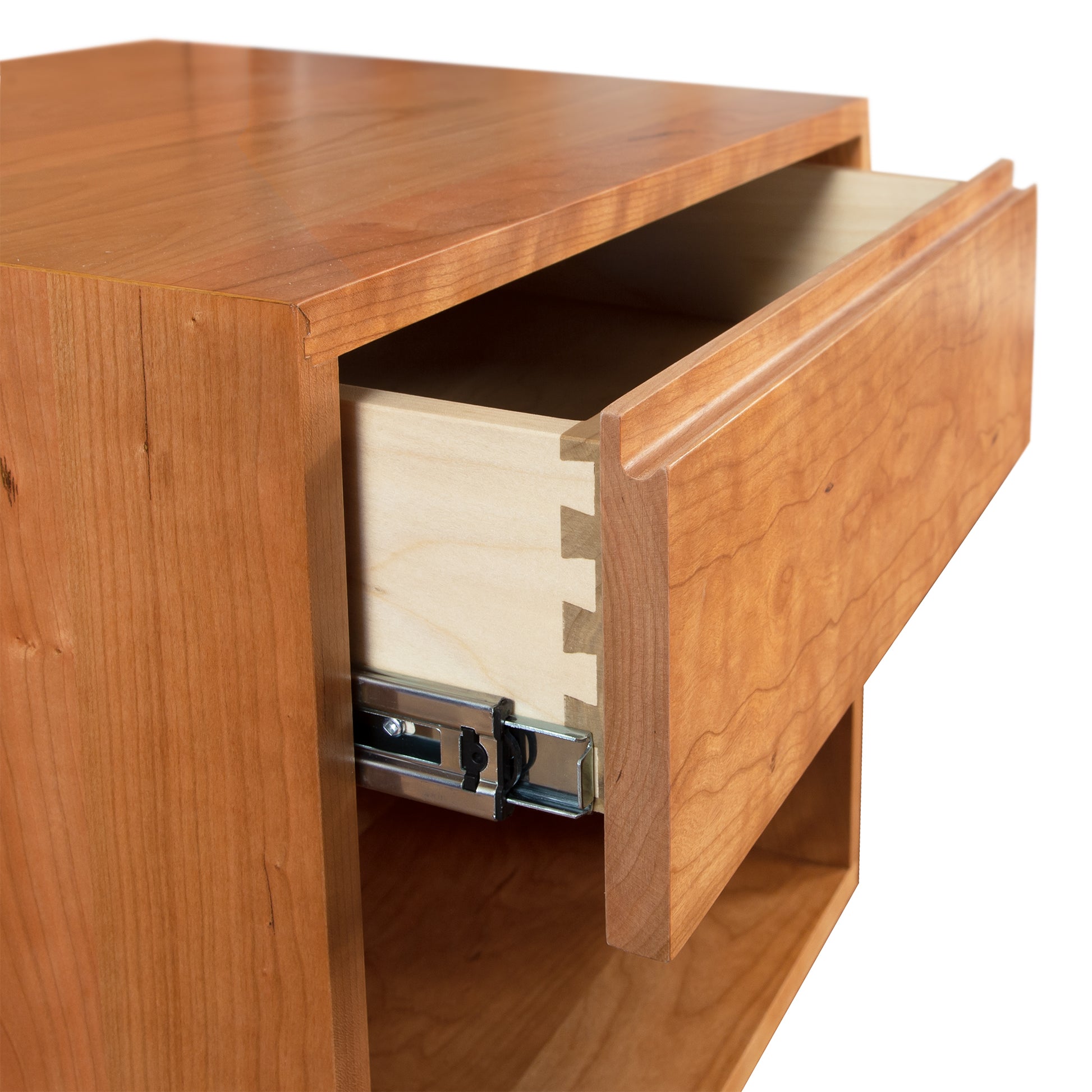 A wooden nightstand with an open drawer.
