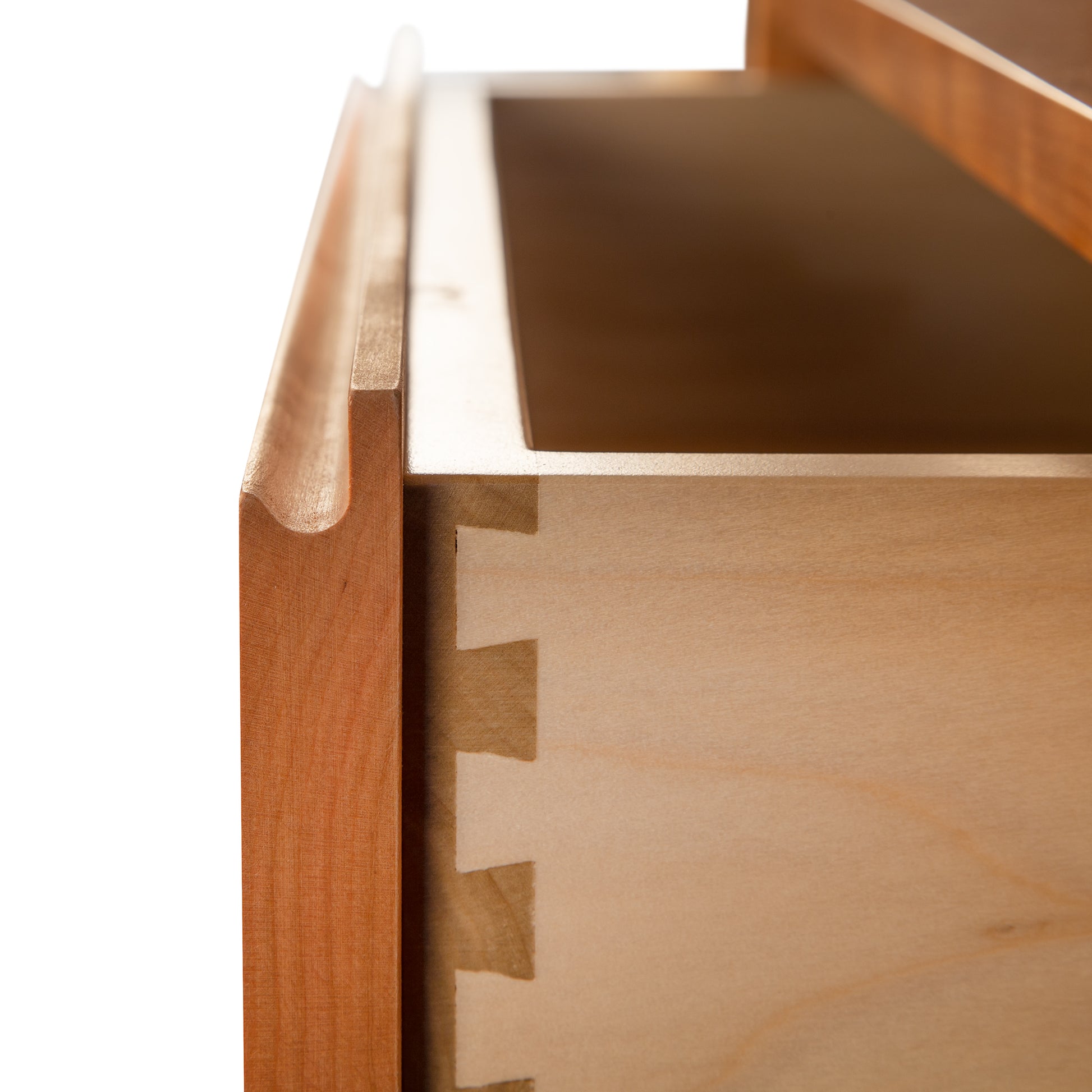 A close up of a wooden drawer.