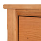 A close up image of a wooden dresser.
