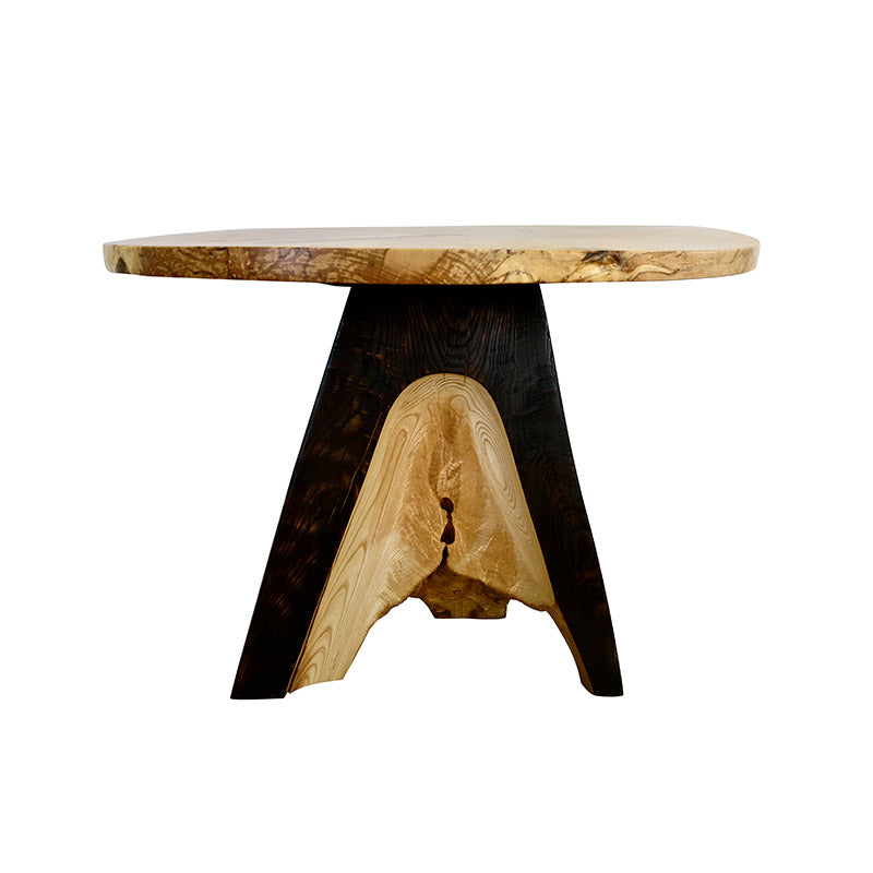 A round table with a black base and a wooden top.